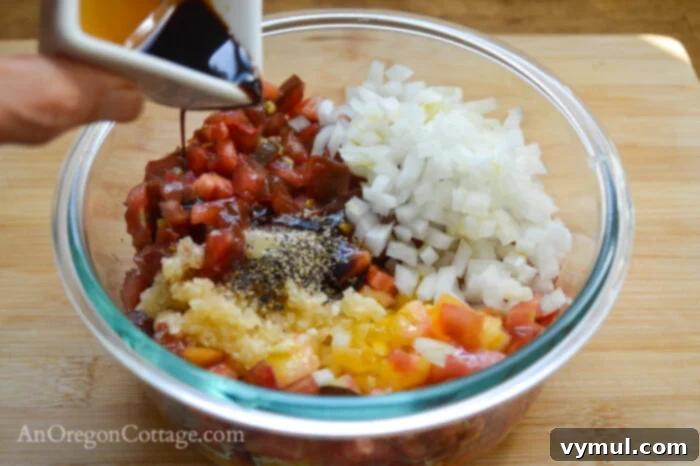 hands dicing tomatoes and onions for fresh tomato bruschetta
