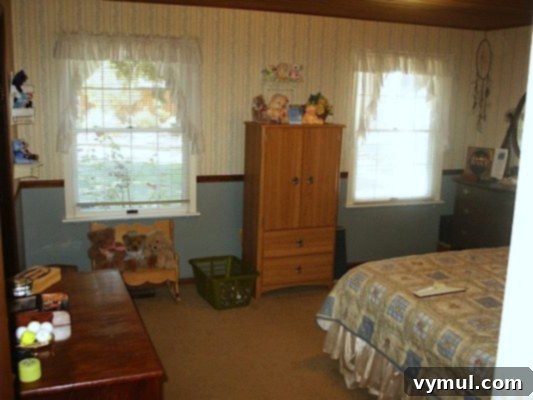 Series Three: Reimagining Our Restful Retreats 8 Master bedroom before remodeling, showing dated wallpaper and decor - An Oregon Cottage
