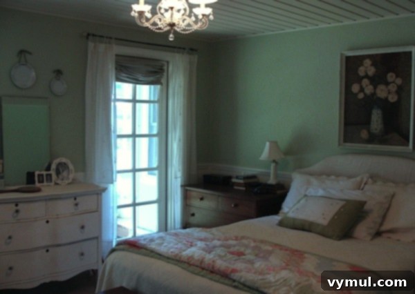 Series Three: Reimagining Our Restful Retreats 10 Master bedroom after remodel with French door leading outside - An Oregon Cottage