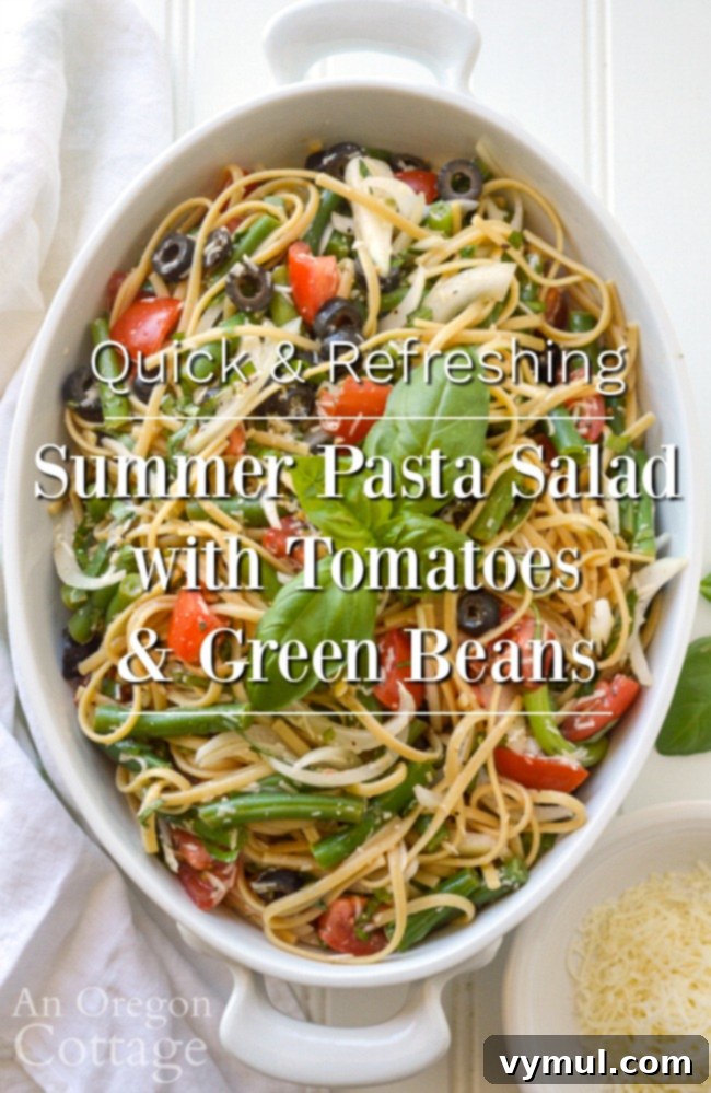 Vibrant and refreshing summer pasta salad with fresh tomatoes, green beans, and basil, perfect for potlucks