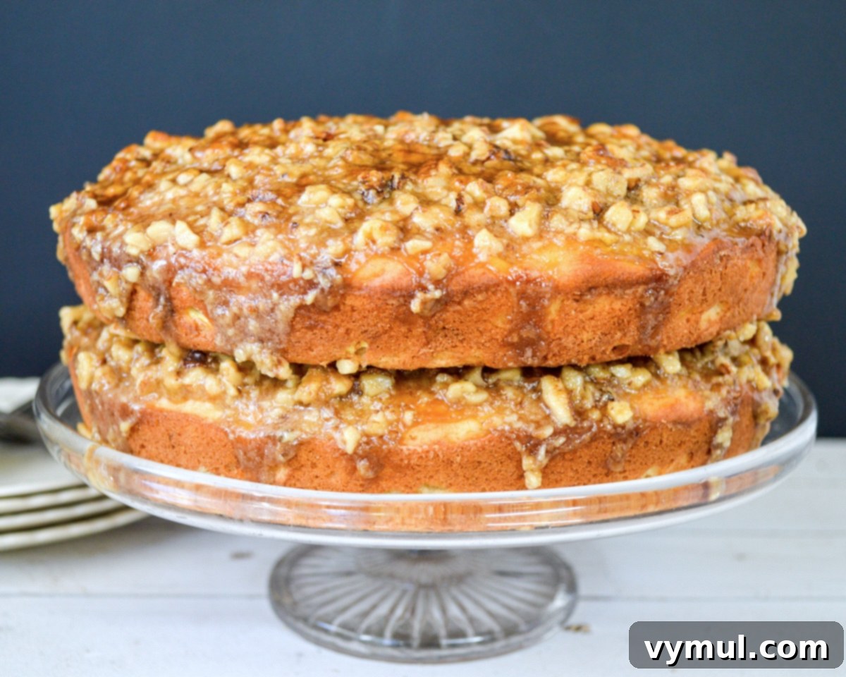 Decadent Moist Zucchini Cake with Toasted Caramel Nut Frosting 13 frosted zucchini cake on glass stand