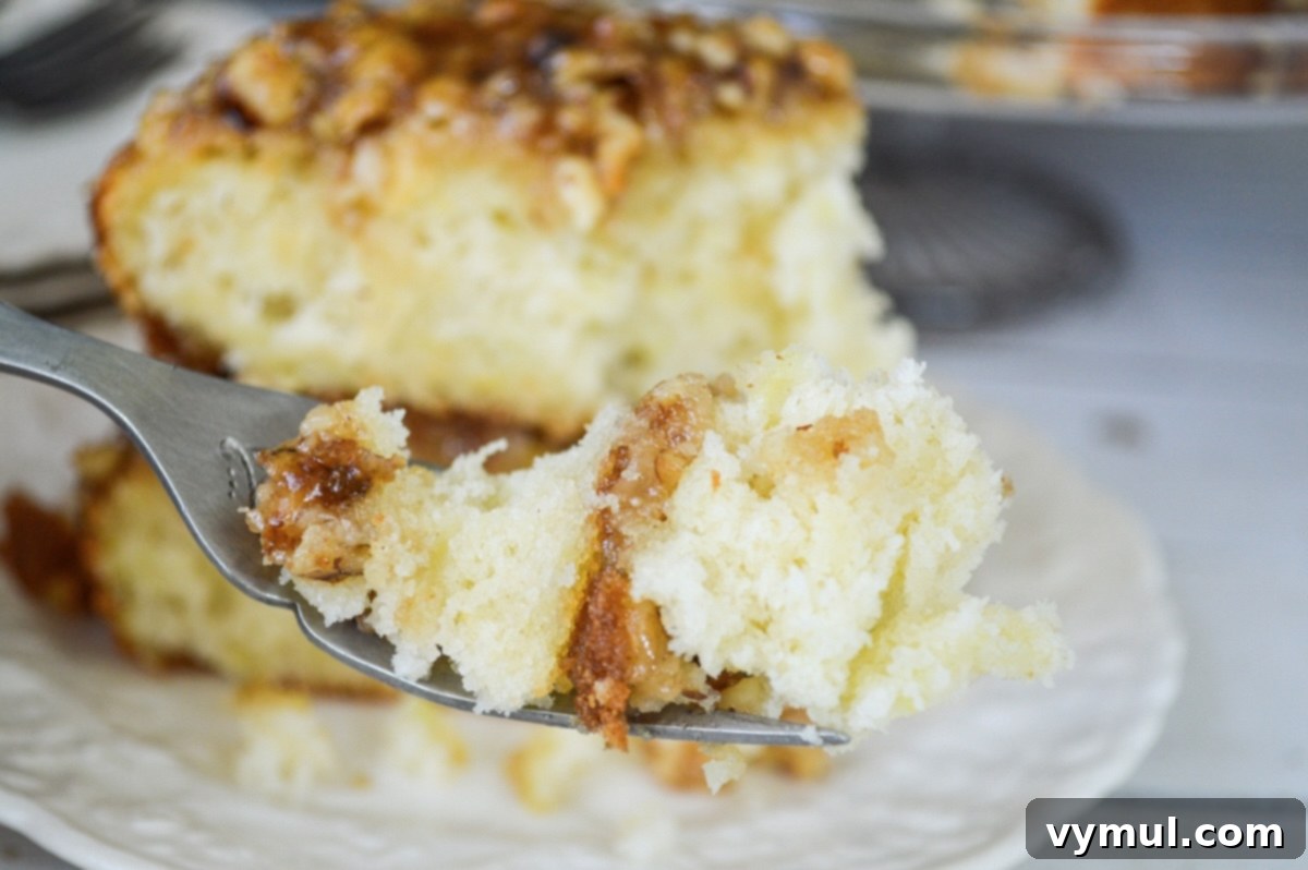 Decadent Moist Zucchini Cake with Toasted Caramel Nut Frosting 4 bit of zucchini cake on a fork