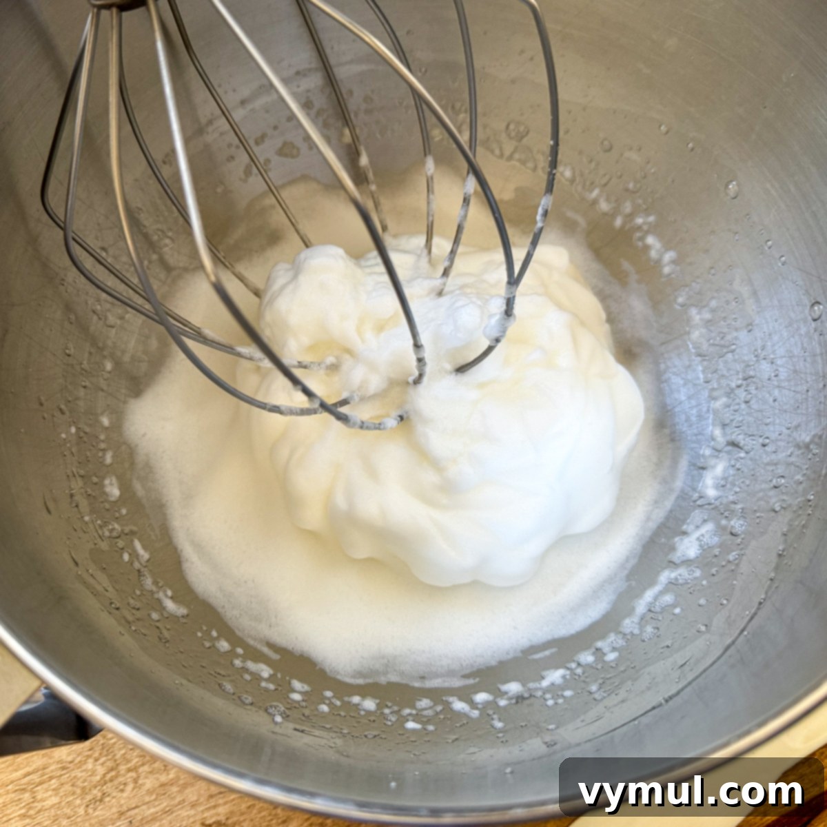 Decadent Moist Zucchini Cake with Toasted Caramel Nut Frosting 8 beating egg whites stiff