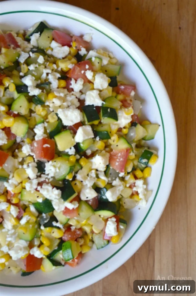 Sunny Zucchini, Corn, and Tomato Skillet with Feta 3 Zucchini Corn and Tomato Saute with Feta- a fresh garden-to-table side dish ready to be served
