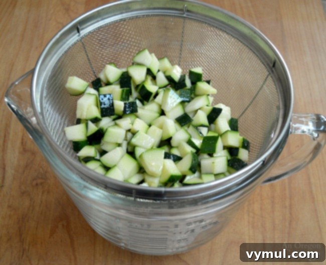 Sunny Zucchini, Corn, and Tomato Skillet with Feta 6 Zucchini Corn and Tomato Saute-draining zucchini in a colander