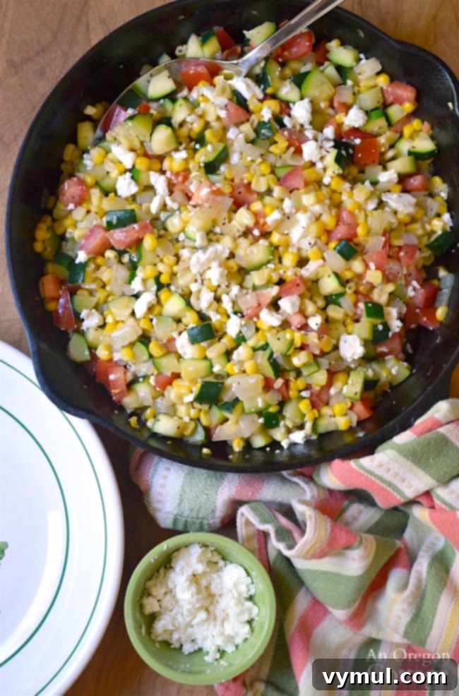 Sunny Zucchini, Corn, and Tomato Skillet with Feta 9 Zucchini Corn and Tomato Saute with Feta-a delicious and easy summer garden-to-table recipe served in a bowl