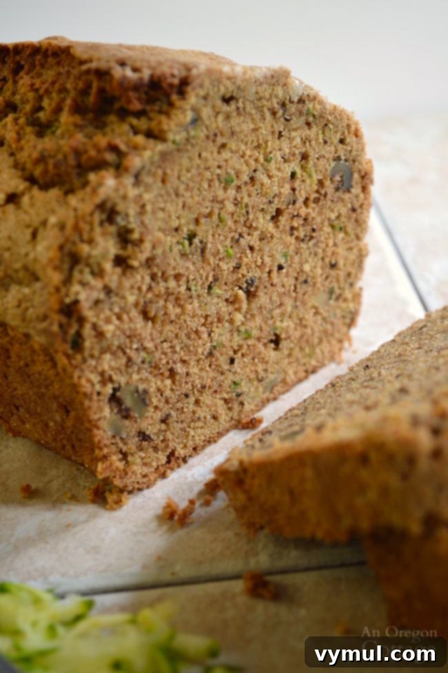 No Fail Whole Wheat Zucchini Bread cooling on a rack, ready for slicing