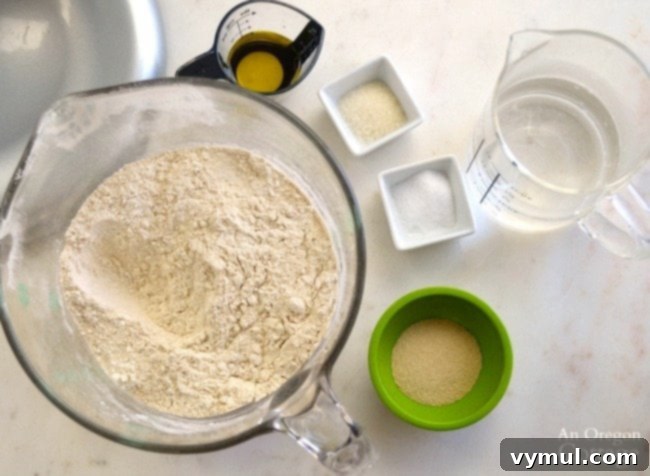 Ingredients for homemade pizza dough laid out on a table