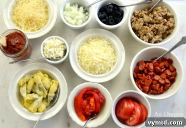 Assortment of pizza toppings in small bowls for a pizza bar