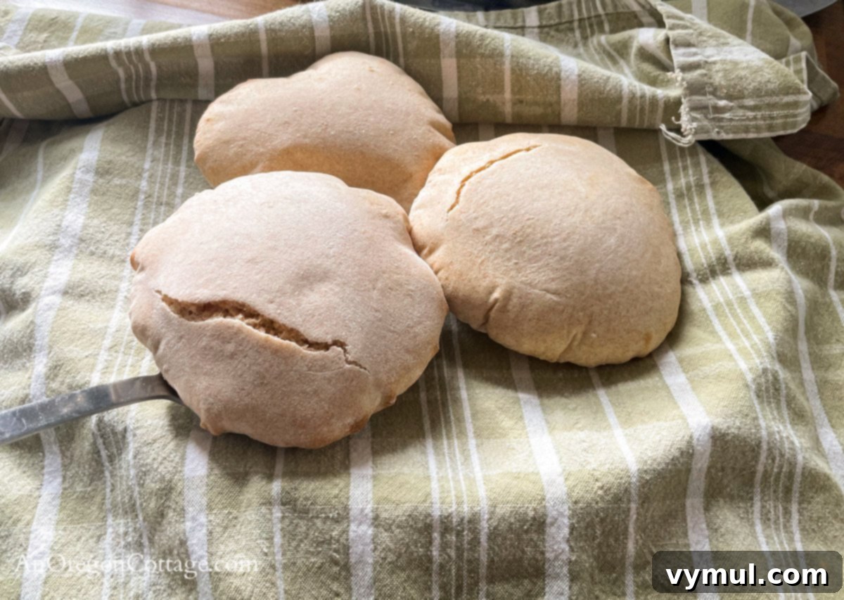Simple Wholesome Homemade Pita 13 cooked pita on towel lined plate
