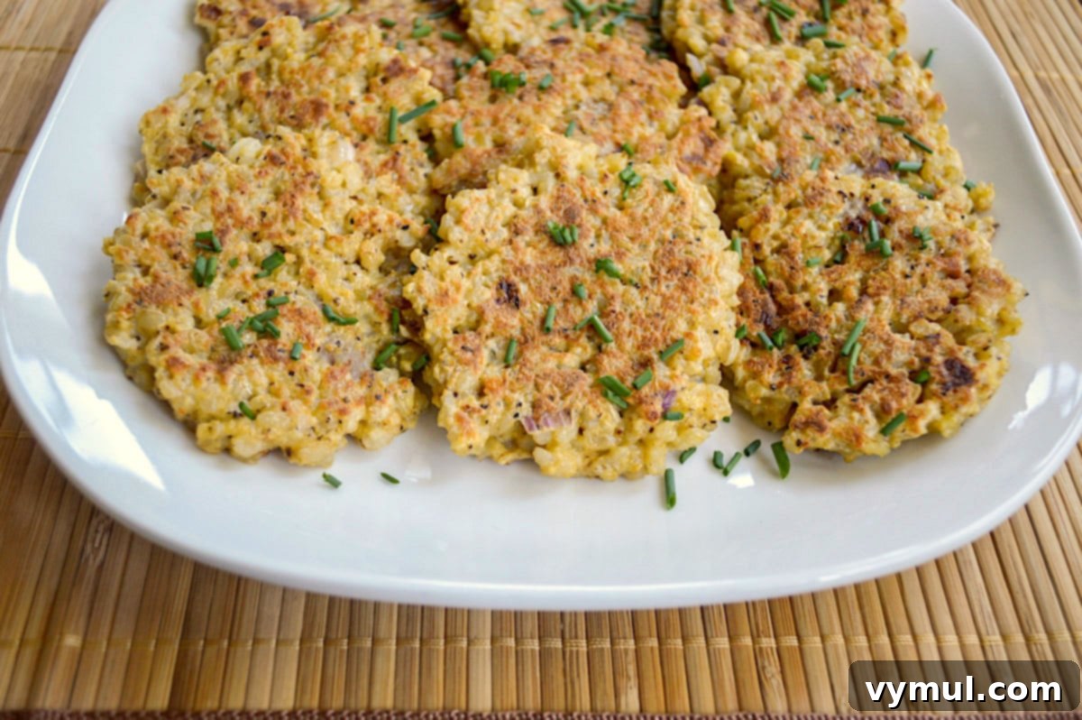 Savory Parmesan Rice Cakes Made Easy 6 cooked rice patties from side on platter