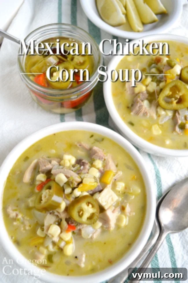 A steaming bowl of creamy Mexican chicken corn soup, garnished with fresh cilantro and a lime wedge, ready to be enjoyed as a quick weeknight meal.