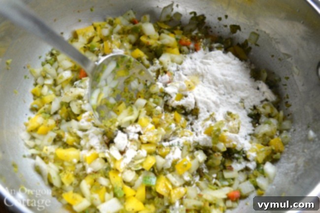 Sautéing chopped onions, jalapeños, and bell peppers in a large soup pot with oil, filling the kitchen with savory aromas for a quick Mexican chicken corn soup.