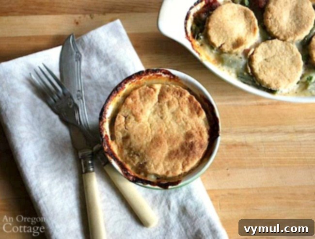 Cheesy Crust Ham Pie baked in individual ramekins, golden brown and bubbly.