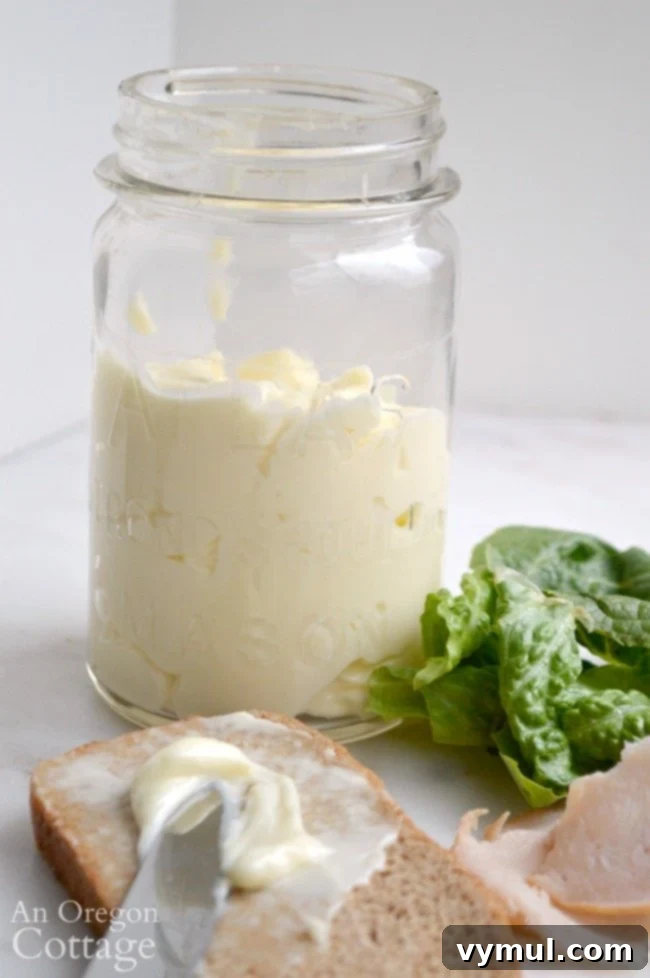 Easy Homemade Mayonnaise in a glass jar with bread slices