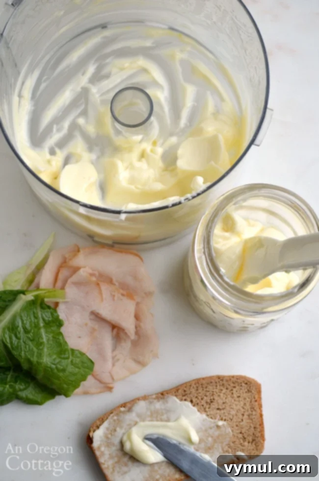 Homemade mayonnaise spread generously on fresh bread, highlighting its delicious texture