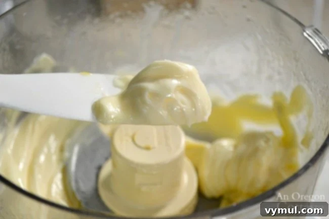 Finished homemade mayonnaise in a food processor bowl