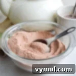 hot cocoa mix in glass bowl with scoop