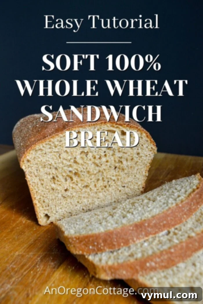 Sliced 100% whole wheat sandwich bread on a wooden cutting board, showcasing its soft texture and golden crust, ready for serving.