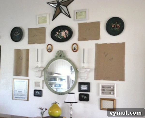 Designing a Perfectly Mismatched Gallery Display 5 Eclectic gallery wall step 2-hanging with paper templates