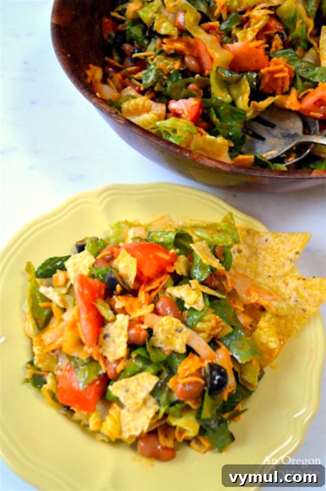 Tex-Mex Salad with beans and chips served on a plate