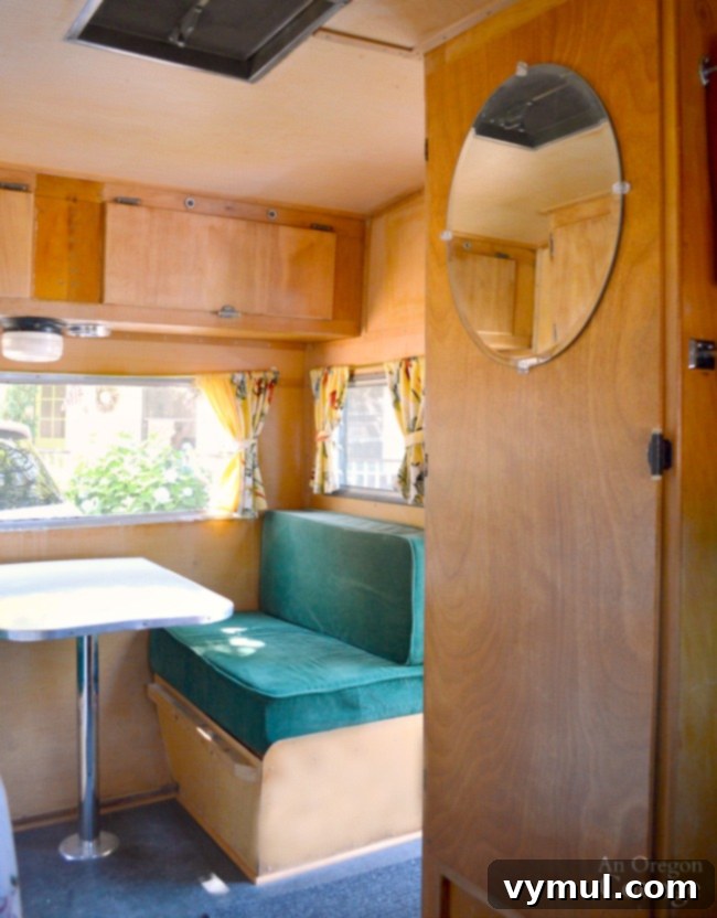 Ep. 5: Camper Quirks, Culinary Conquests, and Canine Catastrophes 6 The renovated closet and bench area of the Dalton Vintage Trailer, featuring clever storage solutions and a matching new door.