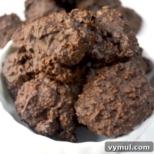 Effortless 3-Ingredient Low Sugar Dark Chocolate Coconut Clusters 7 Finished Dark Chocolate Coconut Clusters ready to be enjoyed.