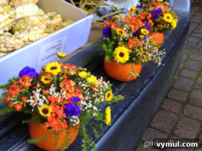 Thanksgiving Crunch Time: 23 Last-Minute Ideas for Doing, Dining, & Discovering 22 Tailgating-Fall-Style-with-planted-pumpkins-at-the-farmers-market, a creative fall arrangement featuring small pumpkins filled with flowers, perfect for a cozy autumnal display.