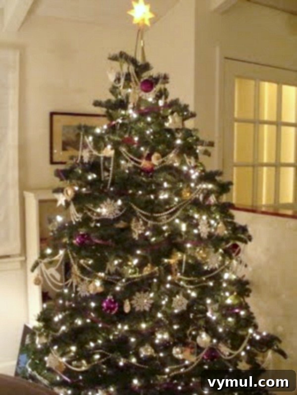 2010 Metallic and purple Christmas Tree: A striking Christmas tree decorated with a mix of metallic ornaments and vibrant purple accents, showcasing an unexpected yet elegant color combination.