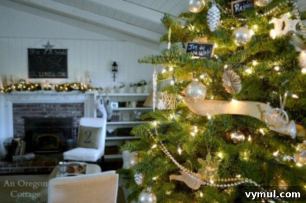 Christmas decor ideas from 2014: A beautifully adorned foyer with a charming Christmas tree, showcasing the cozy Cottage Christmas theme.