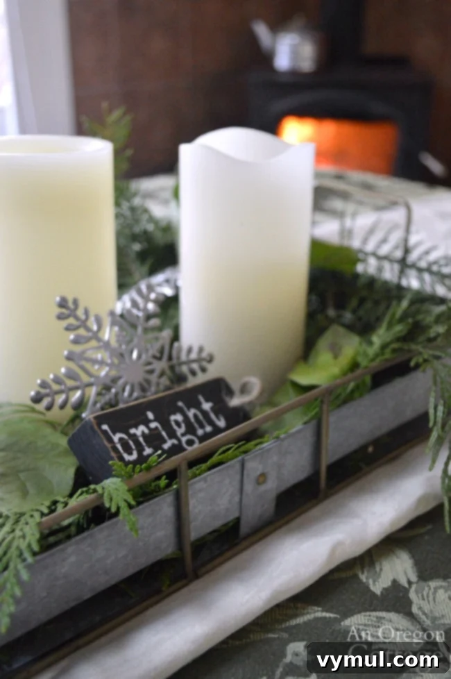 Galvanized tray christmas centerpiece with candles and greenery. #christmasdecor