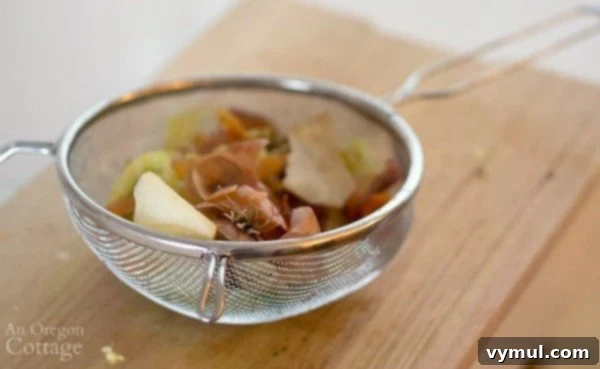 Easy Homemade Bone Broth Slow Cooker and Instant Pot 6 Slow Cooker Chicken Broth-straining vegetables