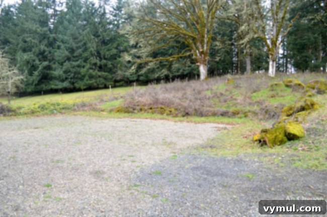 Cultivating Your Farmhouse Kitchen Garden 4 Hillside view of gravel area for future garden.