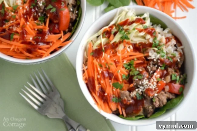 Sriracha Beef & Veggie Rice Bowls for Quick Weeknight Flavor 7 Dining table set with Sriracha Beef and Vegetable Rice Bowls, green napkins, and vintage forks
