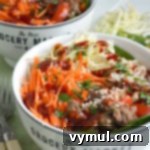 Sriracha Beef & Veggie Rice Bowls for Quick Weeknight Flavor 9 Bowls full of Sriracha beef, vegetables and rice, ready to serve