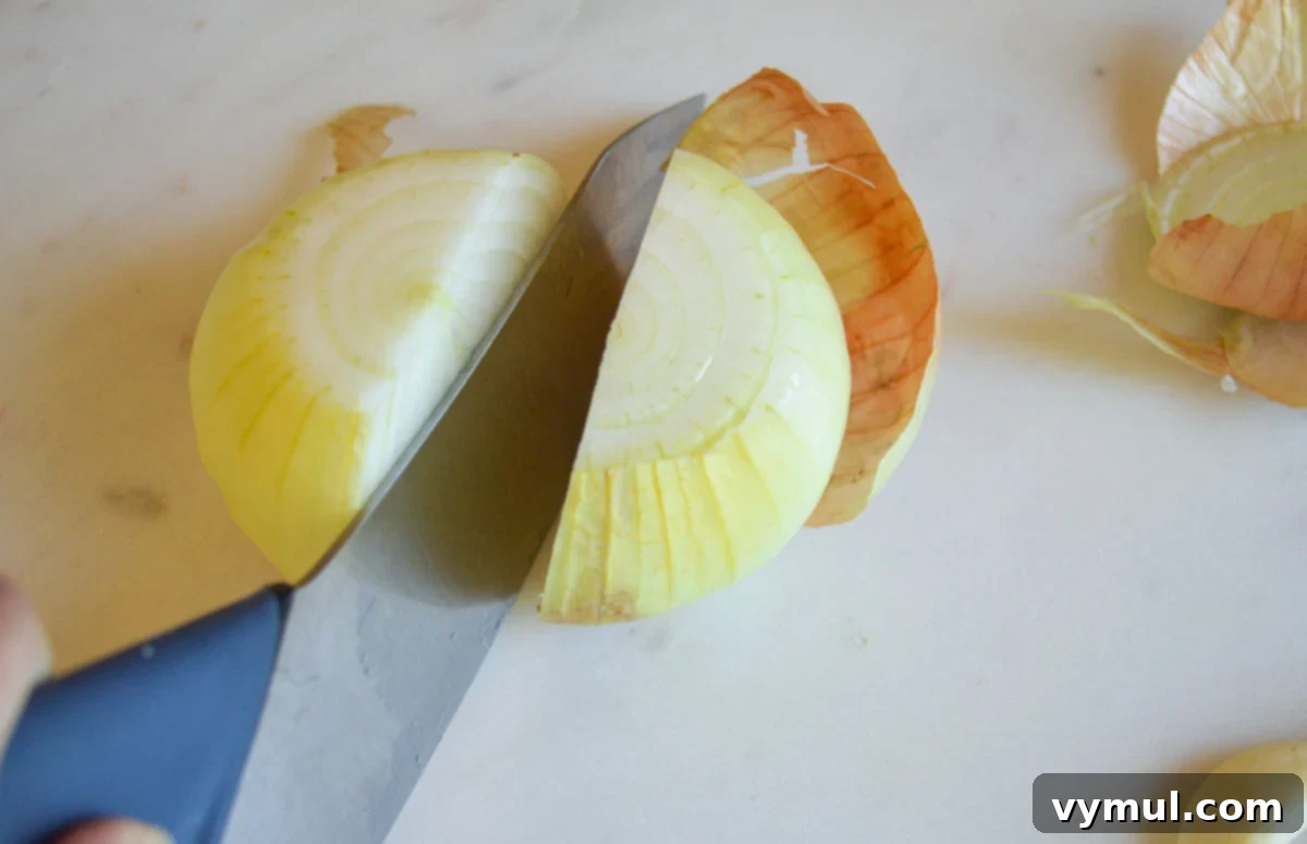 Easy 30 Minute Creamy Shrimp Pasta with Green Beans 4 cutting ends off onion and in half