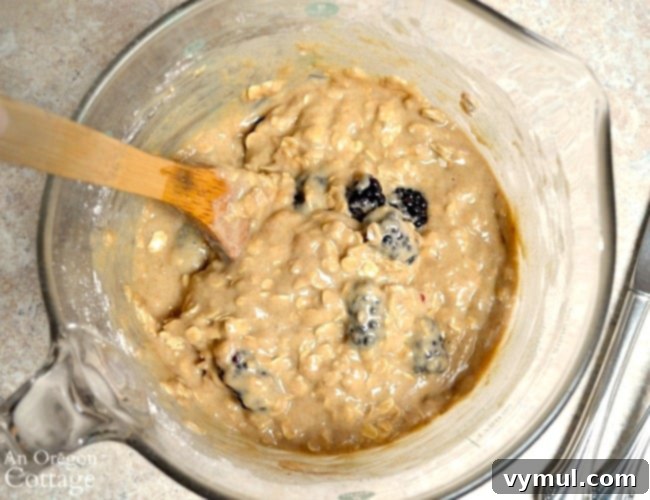 Honey-Kissed Blackberry Oat Muffins 5 Mixing muffin batter