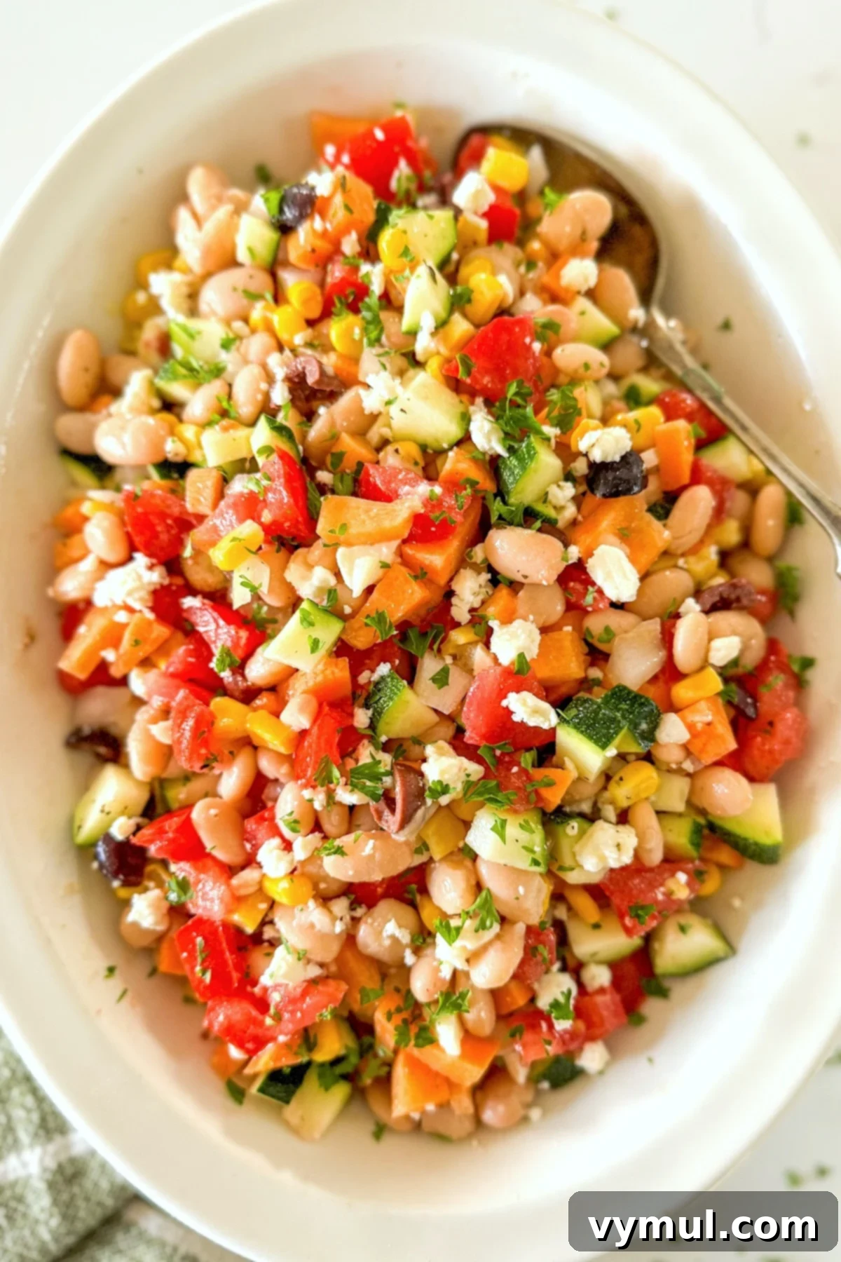 Fast Flexible Chopped Salad 7 Close-up aerial view of a colorful chopped salad in a white bowl