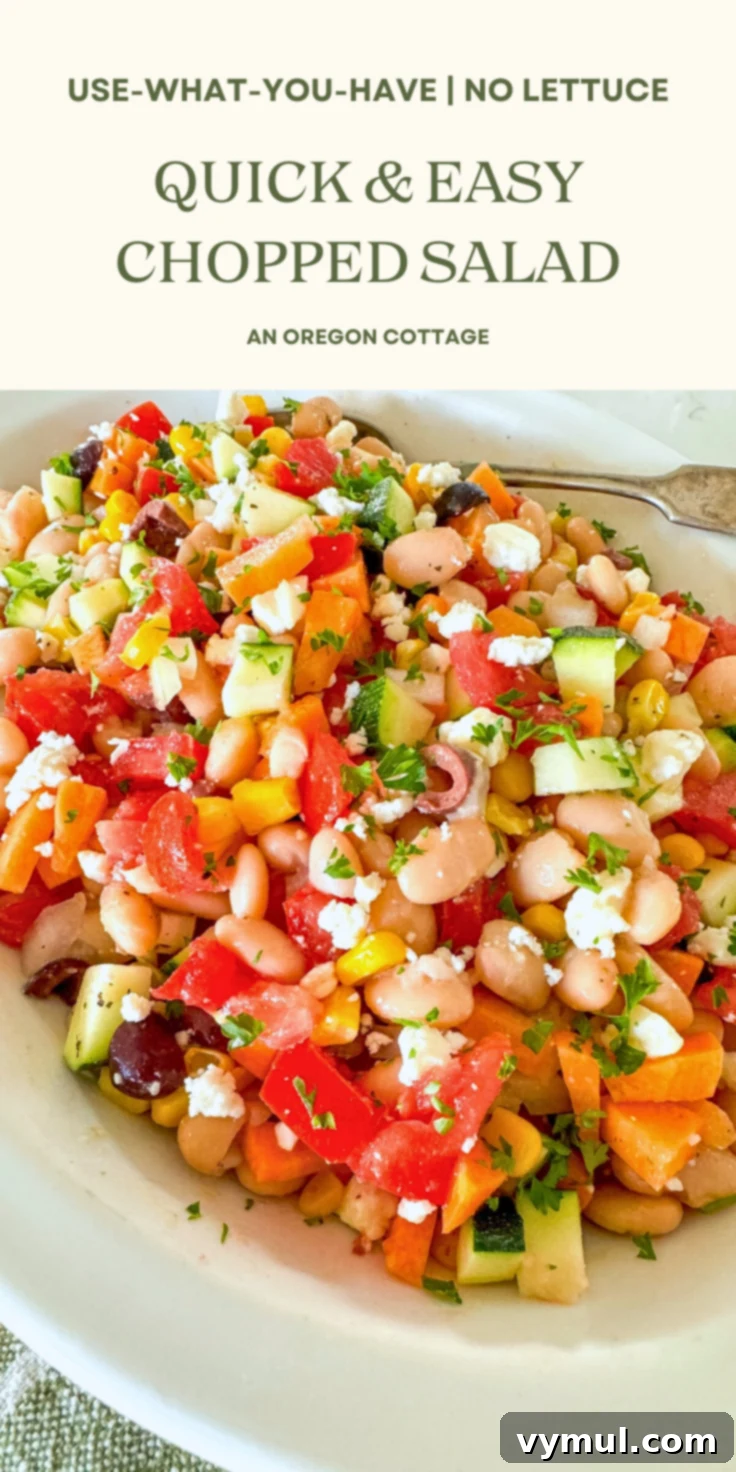 Fast Flexible Chopped Salad 10 A tall glass jar filled with layers of chopped salad, ideal for meal prep