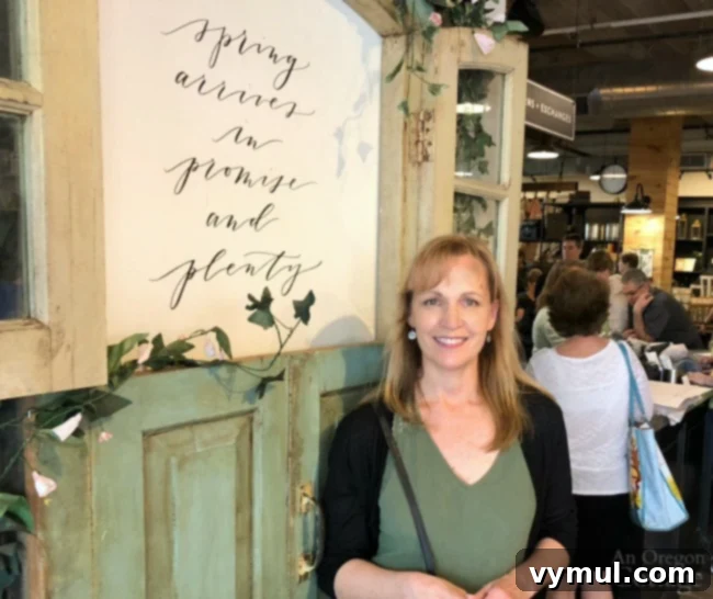 Standing in front of door display at Magnolia Market