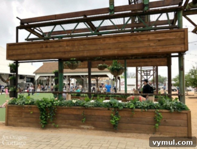 Spring garden ideas-Wood and metal table area with raised planter