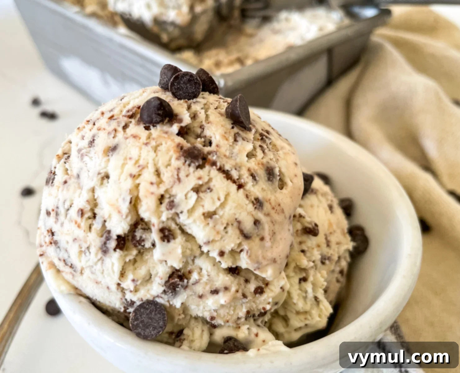 16 Wholesome & Easy Desserts: Six Ingredients or Fewer 9 no churn chocolate chip ice cream in white bowl with chocolate chips