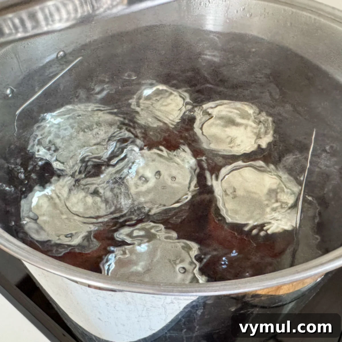 Homemade Rotel-Style Tomato and Green Chili Mix 9 boiling jars of Rotel in canner