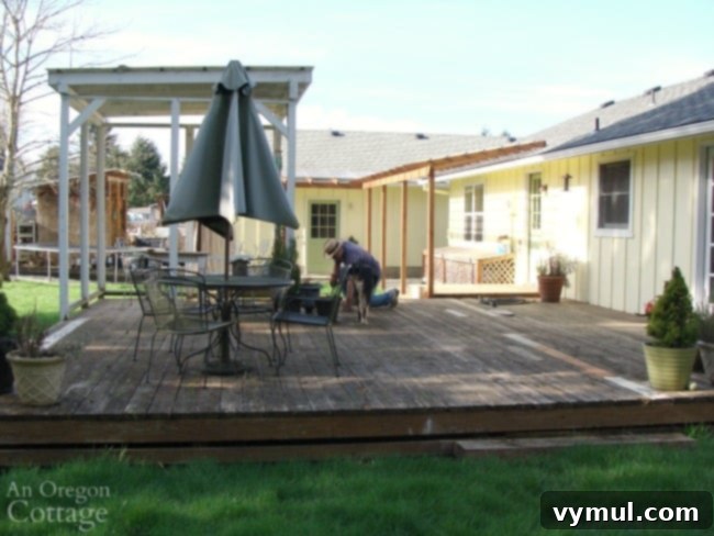 Crafting an Outdoor Oasis Four Rooms from a Single Rotten Deck 3 Original large, unused backyard deck before DIY makeover