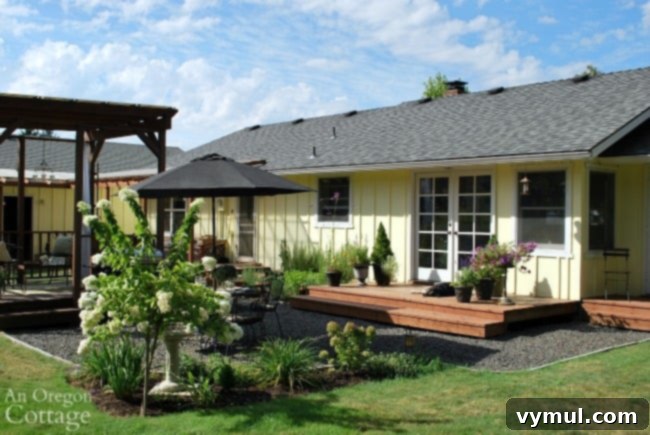 Crafting an Outdoor Oasis Four Rooms from a Single Rotten Deck 4 Transformed backyard with gravel patio, garden, and gazebo