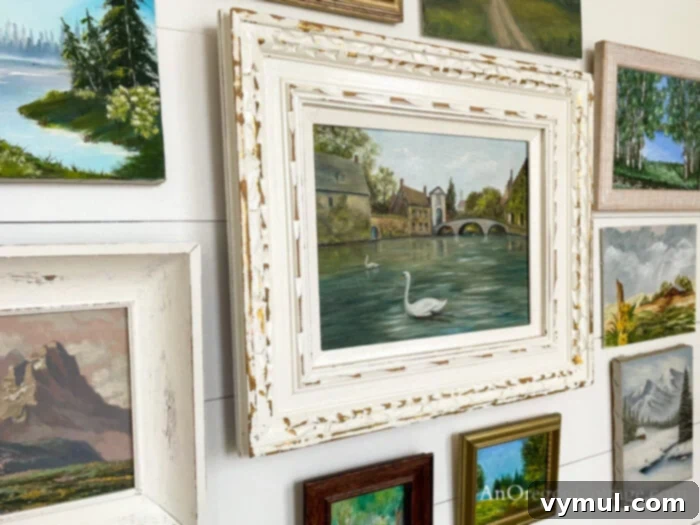 Thrift Decor thrifted oil painted landscapes on white wall