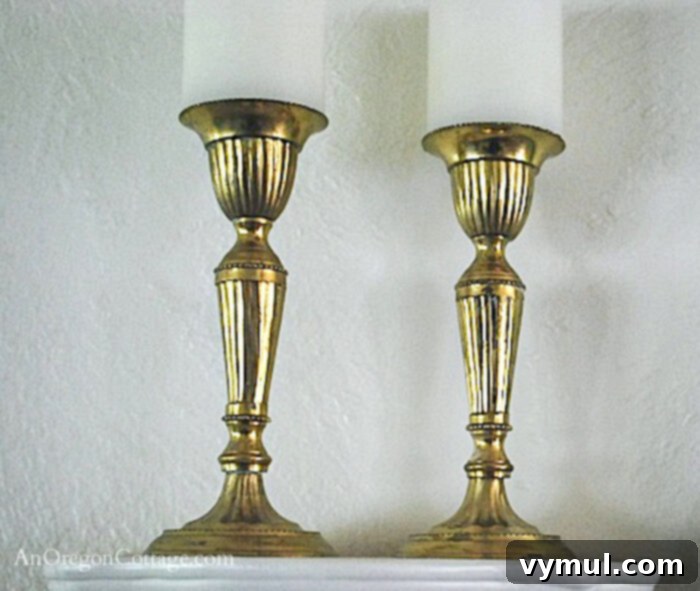 10 Hidden Gems Savvy Thrifters Always Hunt For 2 Brass candlesticks on a shelf