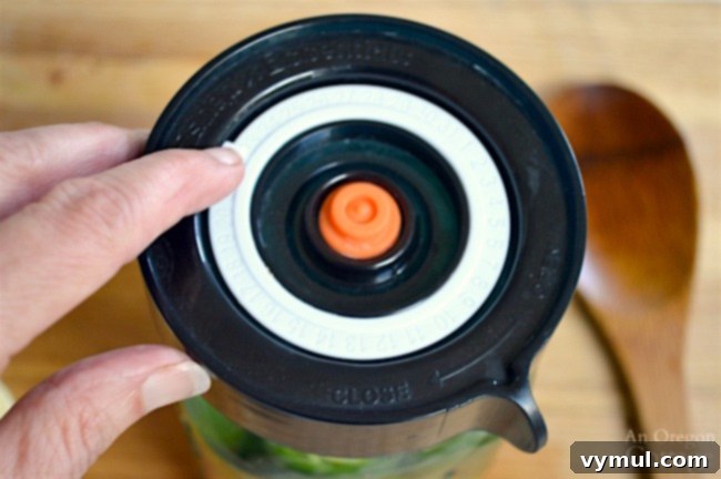 Effortless Fermented Jalapeño Pickles 6 Easy Fermenter Lid with date tracker on a jar of fermenting jalapeños