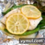 Zesty Lemon Fish and Veggie Grill or Bake Packets 8 Lemon Vegetable Fish Foil Packets grilled, showing a delicious meal ready to eat