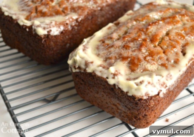 Baked orange zucchini bread with a cooling low sugar glaze